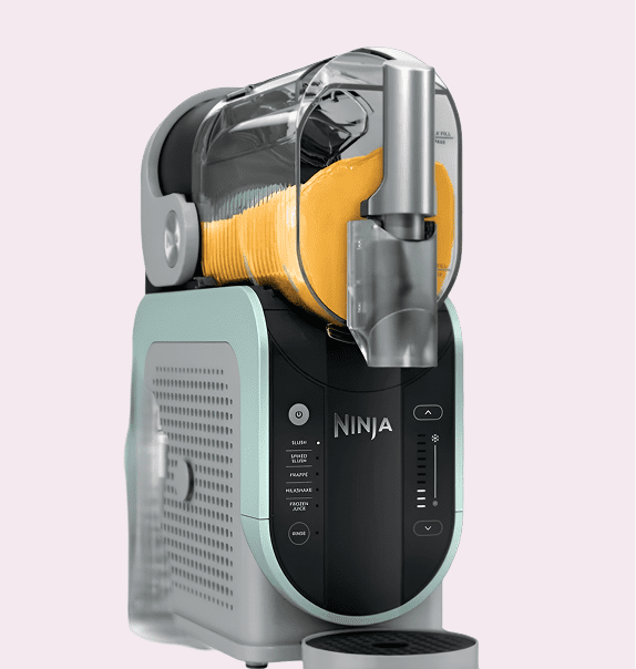 Ninja slicing machine with yellow slices inside.